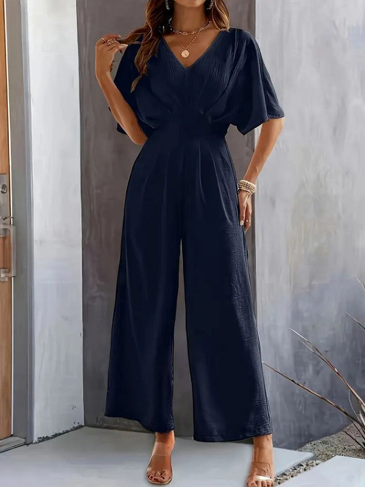 Jumpsuit för kvinnor | V-ringad och draperad design | lättviktspolyester för vår och sommar